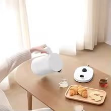 Bouilloire température réglable thé croissants table