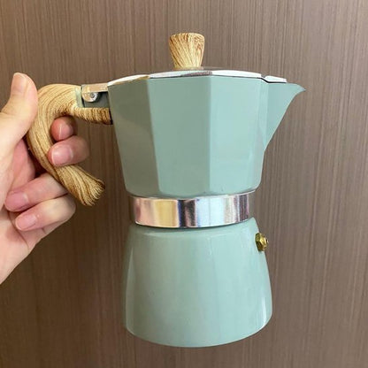 Cafetière italienne bleue main