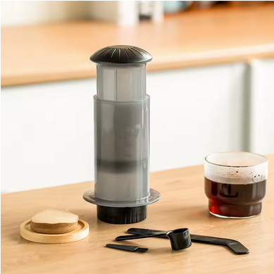 Expresso Nomade Portable sur table avec café