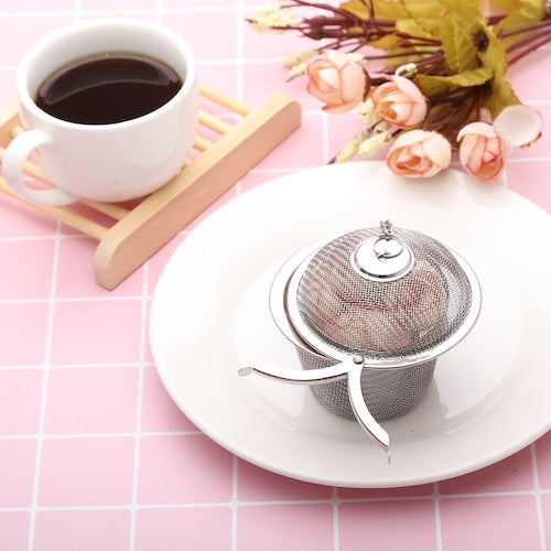 Insuseur de the Jardin d'infusion dans une assiette